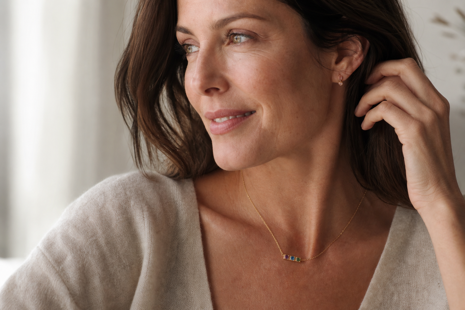 Three-stone birthstone necklace for mom — her children's birthstones in solid gold